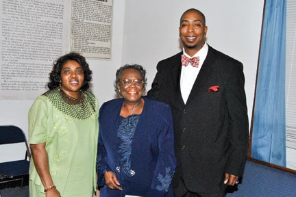 Helen Stallworth, left, and Dandrea J. Evans Sr., right, vice president and president of the Lowndesboro School Alumni Association, join Lizzie Johnson Thomas, the last living teacher from the circa 1868 constructed Lowndesboro School.