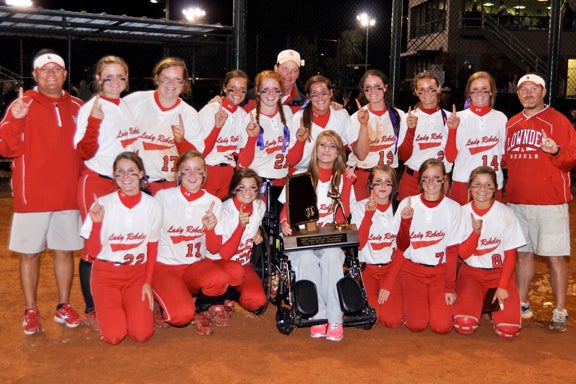 The Lowndes Academy Lady Rebels are the Alabama Independent School Association's 2A State Softball Champions for 2013. The team coached by Matt Marshall, far right, P.J. Gallardo, far left, and Ron Wilkinson, middle, includes (2) Abby Ray, (4) Abby Pitts, (7) Laura Jean McCurdy, (8) Jessica Gallardo, (10) in wheelchair, Shelby Pitts, (11) Emily Dunning, (12) Sarah Ann McIntosh, (13) Kailan Sheperd, (14) Taylor King, (17) Paige Hill,  (18) Anna Marie Bozeman, (19) Mallory McCurdy, (20) Carmen Till, (21) Hailey Wilkinson and (22) Caroline Bennett. 
