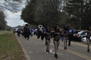 Sydney Lanier Band marches in White Hall Black History Month Mardi Gras style parade held Saturday.