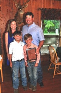 Father of the Year: Michael Dansby, pictured with his wife Allyson and sons, Cooper and Crawford was named Father of the Year by the Lowndes County Cattlewomen's Association Tuesday, June 21. Fred Guarino/Lowndes Signal.   