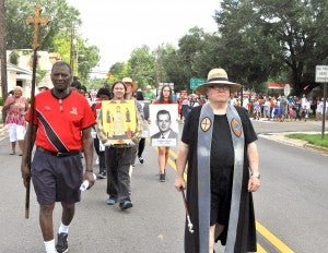 Pilgrims proceed toward the old Lowndes County Jail in Hayneville and the Cash Store in the 21st annual Jonathan Myrick Daniels Pilgrimage and Procession.