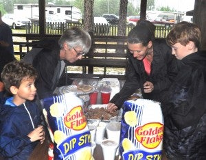 The Fort Deposit Arts Council provided free camp sites with free water and electrical hookups for Hurricane Michael evacuee, as well as a hot lunch Wedensdasy, Oct. 10. From left are evacuees Andrew Toole, Roberta Paoni, Janice and Dylan Toole.